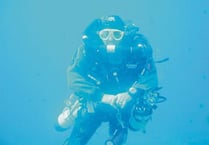 Deep feelings as wreath is laid by divers
