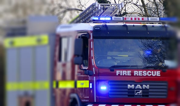 Woman rescued by fire crews after car aquaplanes and crashes