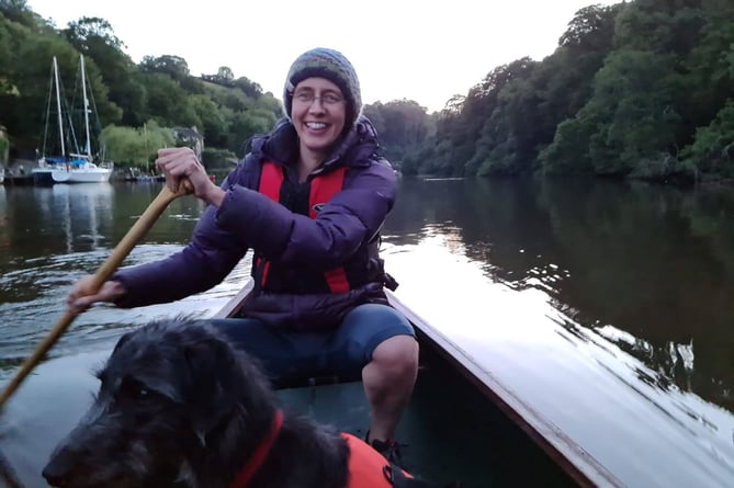 Transition Streets project manager, Ruth Leonard-Williams, with her dog Bramble enjoying a paddle on the River Dart.  