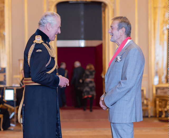 Former CEO presented with CBE in intimate Windsor Castle ceremony 