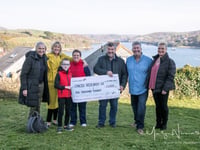 Rotary club presents cheque to Cancer Research UK