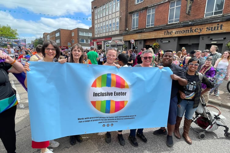 Inclusive Exeter volunteers taking part in an Exeter Pride March.
