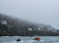 Salcombe RNLI rescue children,  adults and a dog from capsized RIB