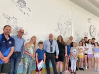 Artist designs beautiful murals for Dartmouth swimming pool