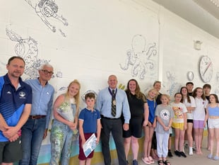 Artist designs beautiful murals for Dartmouth swimming pool