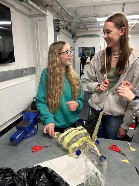 Two students at Dartmouth Academy learn about marine engineering