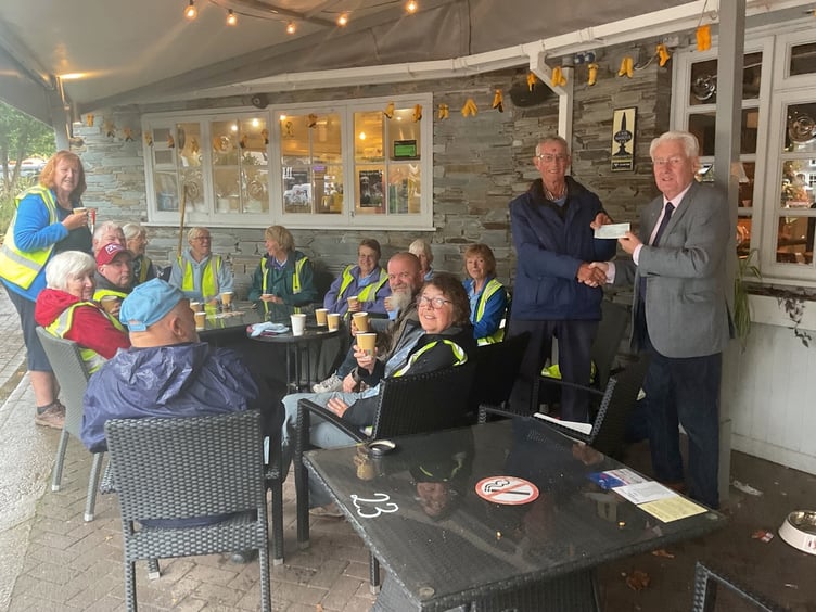Some of the hardy group of volunteers having a coffee break and sheltering from the rain