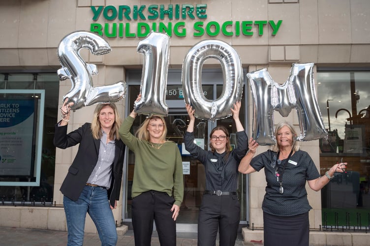 Laura Newton and Linzi Morgan, Trustees of Yorkshire Building Society Charitable Foundation with branch colleagues
