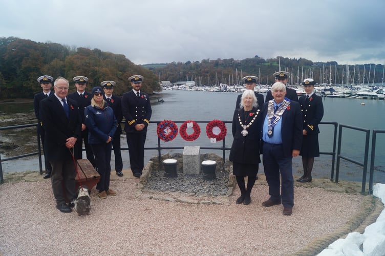 Wreaths are laid at Noss on Dart Marina at Kingswear where more than 20 people lost their lives when the shipyard was bombed during WW2.  Pictured are representatives from the Britannia Royal Naval College and Noss on Dart Marina along with Kingswear Parish Council Chairman Lynne Maurer, county and district councillor Jonathan Hawkins and the Old Dartmothians President Hilary Bastone.