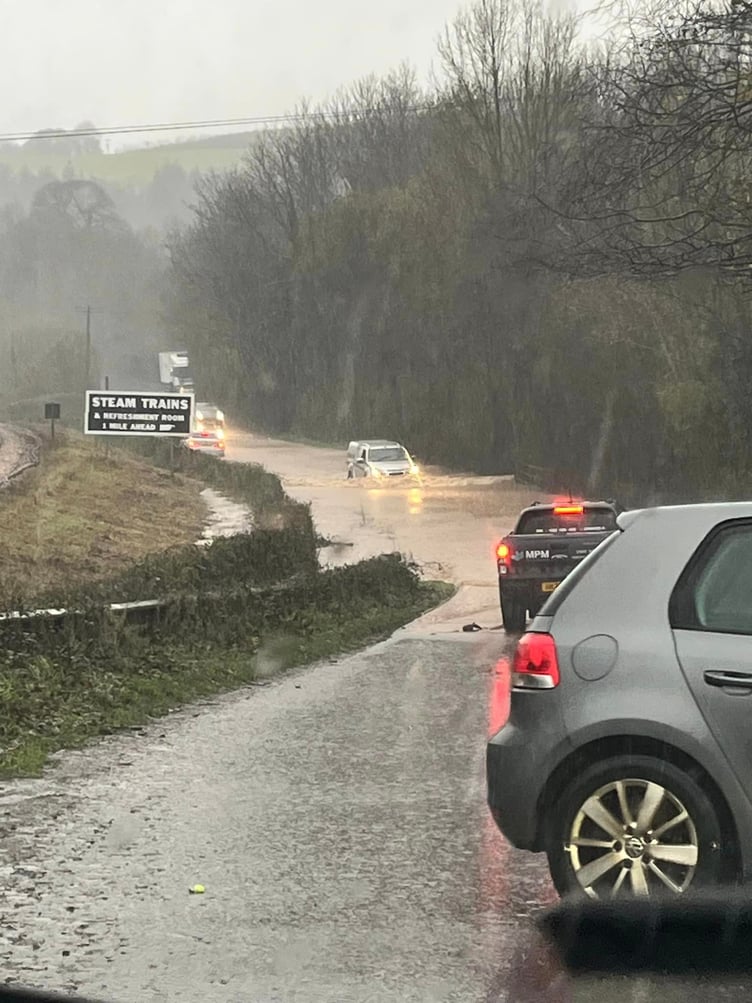 Cars waded through a flooded road between Dartington and Buckfastleigh at the weekend