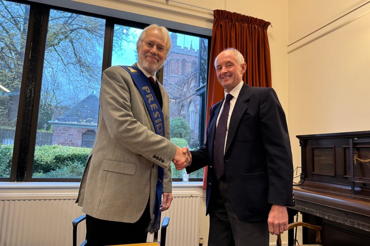 Devon Association of Ringers new president Ian Avery, left, with the President’s Sash, is congratulated on his role by outgoing president John Warne.  AQ 7917
