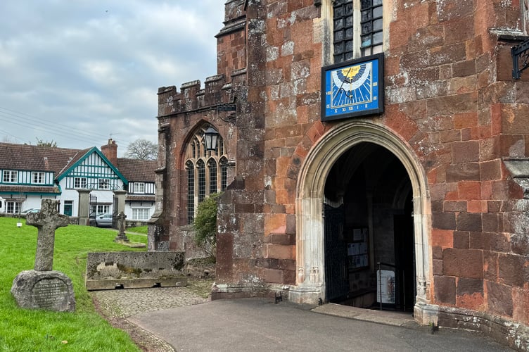 The South door to Crediton Parish Church and the temporary barrier on the pathway to the left.  AQ 2486
