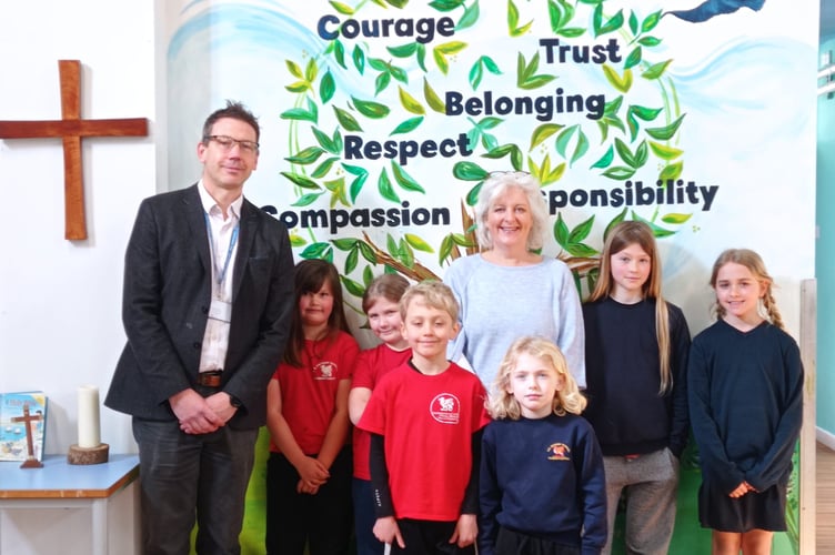 Headteacher Jack Pemberton with Caroline Voaden and pupils  