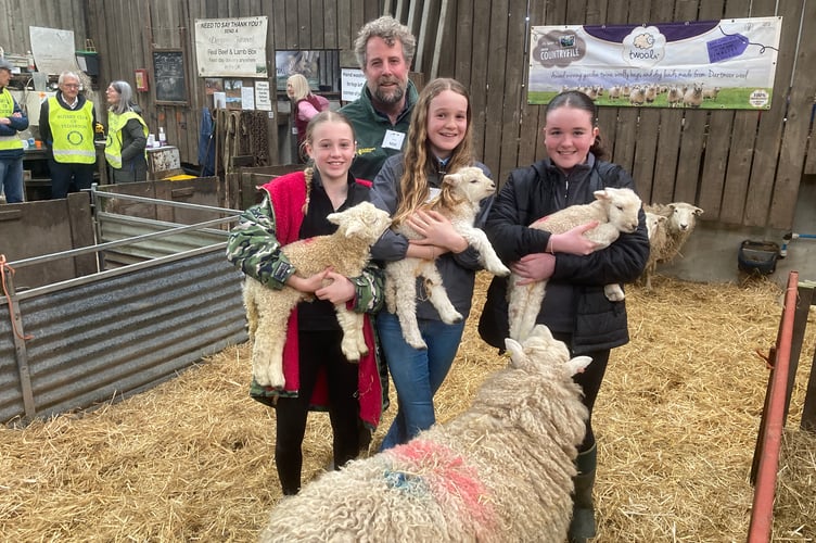 Mat and his young helpers holding lambs