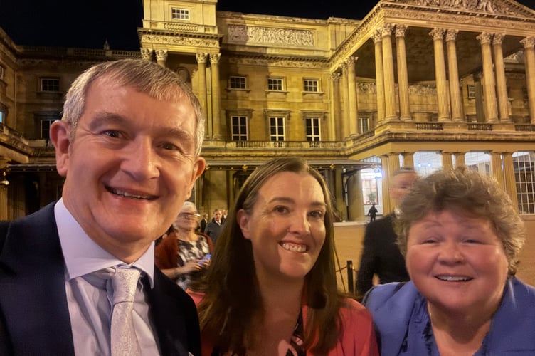 Alan Quick, Editor of the Crediton Courier, left, with Julie McNicholls Vale, Deputy News Editor of the Cambrian News, with right, Liz Davies, Regional Editor for a number of Tindle’s Welsh titles, leaving the Buckingham Palace reception.  AQ 7385
