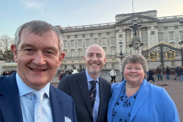 Alan Quick, Editor of the Crediton Courier, left, with Scott Wood, Managing Director, Tindle News and Liz Davies, Regional Editor for a number of Tindle’s Welsh titles, outside Buckingham Palace.  AQ 7376

