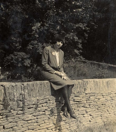 Smartly-dressed woman on wall - linked to Luscombe family of Horsemans Close, West Alvington