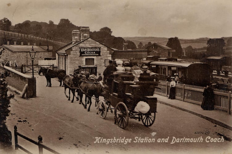 Dartmouth Coach approaching Kingsbridge railway station with passengers around 1900. Train and wagon already waiting.  