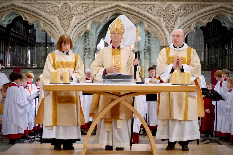 Bishop of Exeter, the Rt Rev Dr Mike Harrison, centre, during the Maundy Thursday Chrism Eucharist service at Exeter Cathedral.
