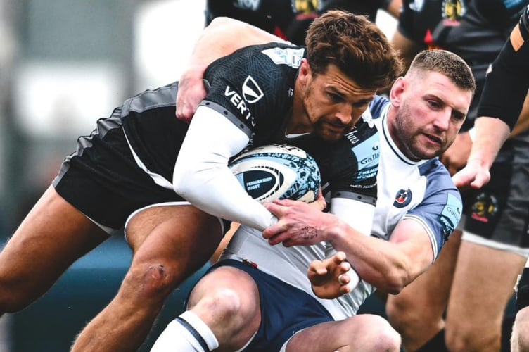 Exeter Chiefs centre Henry Slade looks to find a way past Bath's Finn Russell at Sandy Park