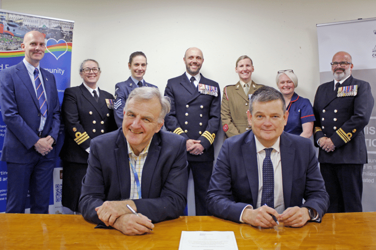 A gathering of military and hospital leaders for the re-signing of the armed forces covenant 