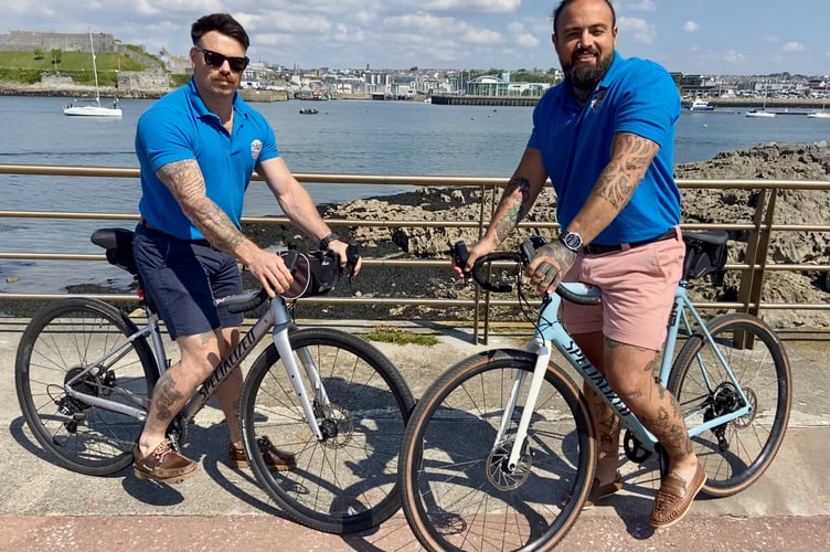 Tugboat & Dolphins fundrasiers Mike Dunn and Jordan Kelevra on the bikes used to cycle to Spain