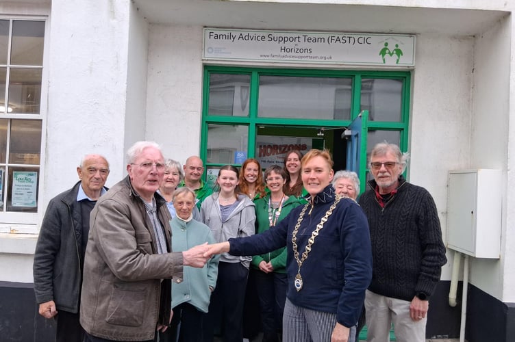 John Turrell, Twinning Association, and Councillor Julia Wingate, Kingsbridge Town Mayor, outside the Youth Club alongside other members of the association with FAST staff and volunteers