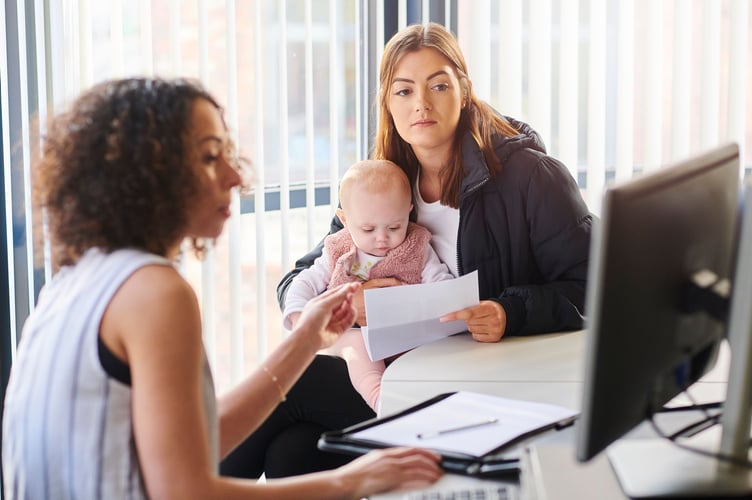 A woman with her baby receives advice