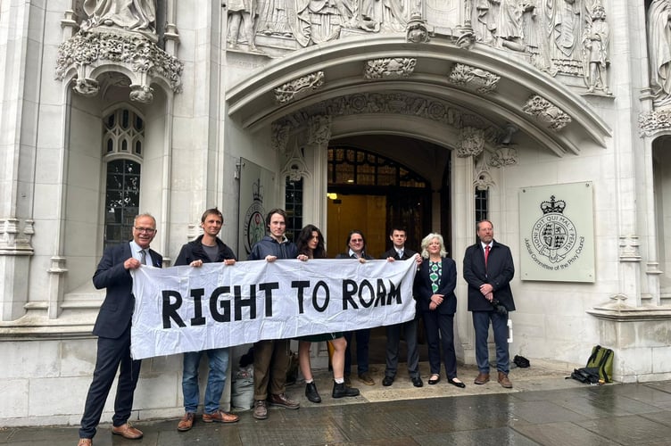 Campaigners outside the Supreme Court today where judges upheld the right to wild camp. 