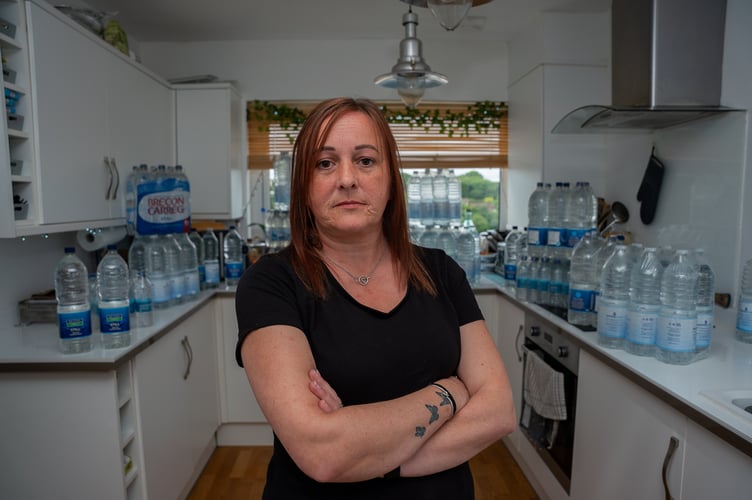Tanya Matthews at her home in Brixham, Devon where she is still under notice to boil her tap water because of a cryptosporidium infestation. Photo released Jaun 5 2024. Tanya said:' When I was on the school playground I heard about people being ill, I noticed there were quite a few people unwell. Then I started being poorly on 6 May, and then it got to 13 May and my mouth just tasted horrendous. The only thing I thought could be causing it was the water - every time I was drinking more water, the taste in my mouth got worse. I rang up South West Water and spoke to someone. They got a scientist to ring me back, and they told me there had been 16 confirmed cases of cryptosporidium, but claimed it had nothing to do with the water.'