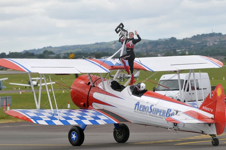 Riviera Air Show. Exeter Airport was used as a staging airfield for many of the aircraft taking part. Wingwalkers on a 1940s vintage Boeing Stearman