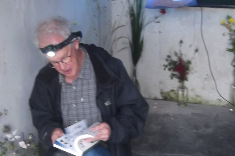 Phil Dean, our moth expert, by the trap in the church porch - Gordon Waterhouse