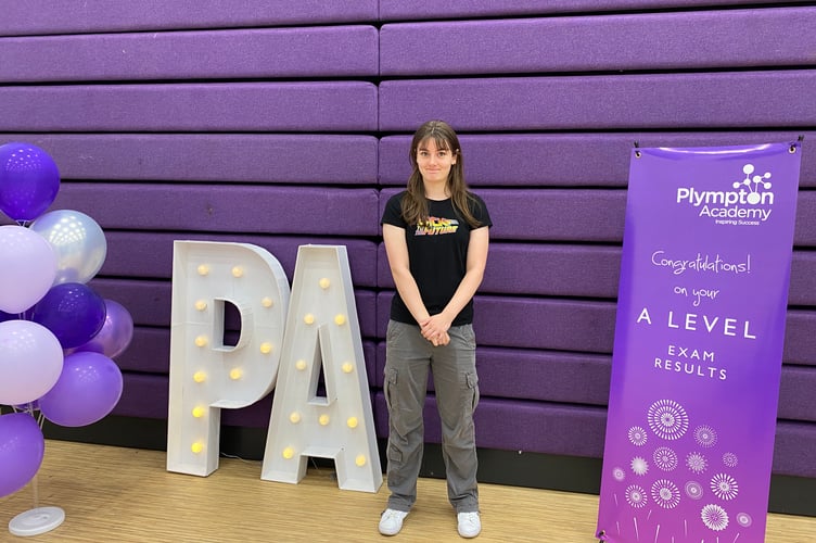 Student shares a smile after opening their results at Plympton Academy