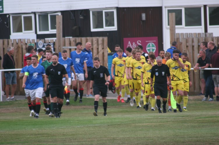 Newton Spurs and Stoke Gabriel players walking out at The Rec