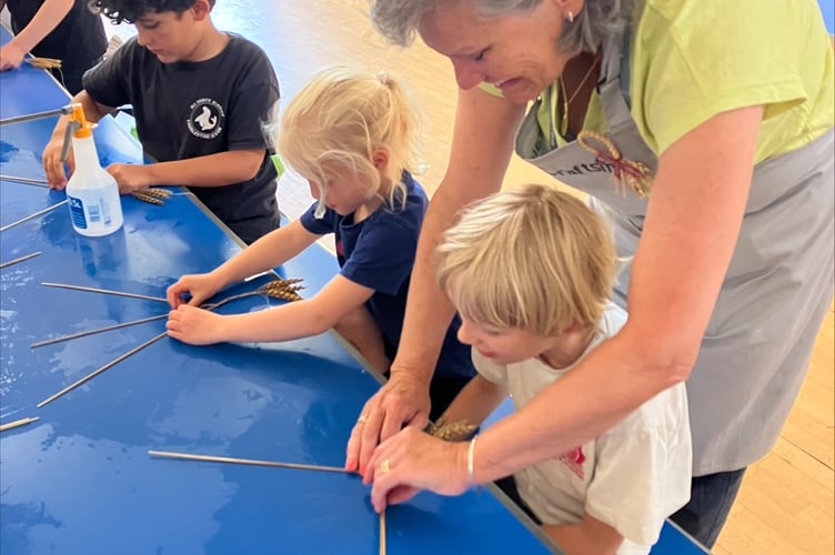 Emma at Thurlestone eco club teaching plaits