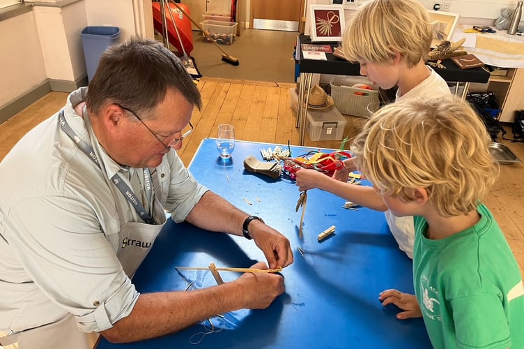 Ian teaching Thurlestone eco club how to plait