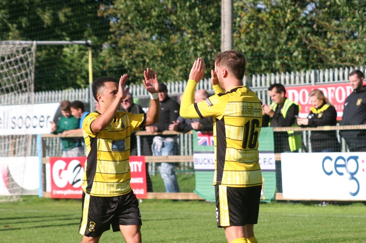 Jack Baxter (right) celebrates scoring Buckland's third