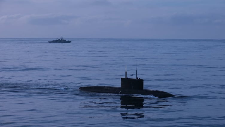 HMS Iron Duke monitors Russian sub