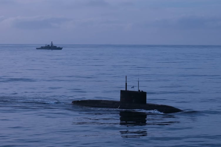 HMS Iron Duke monitors Russian sub
