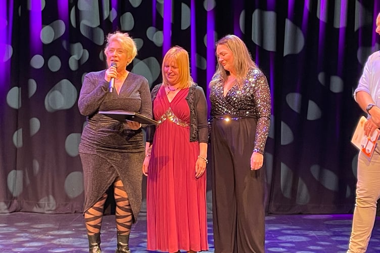 Claire Knight, founder of Phoenix Rising CIC, collects the Stars of Teignbridge Power Award.