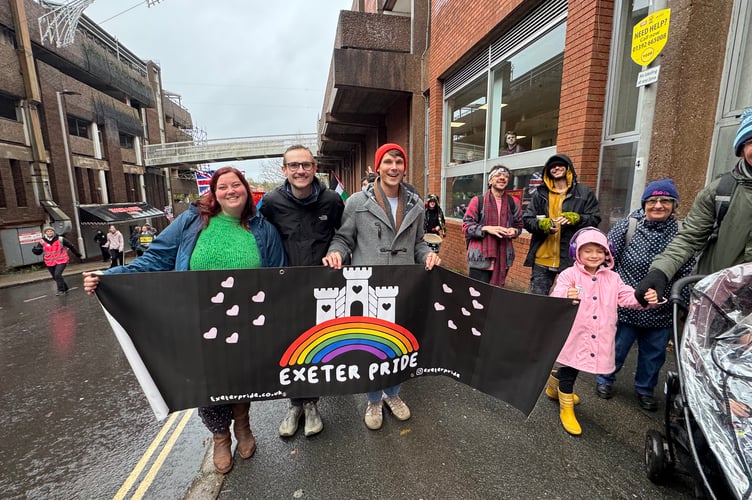 Exeter Pride members walking in the Exeter is for Everyone march.  AQ 8621
