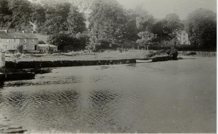 River Avon at Aveton Gifford. Small boats in foreground.