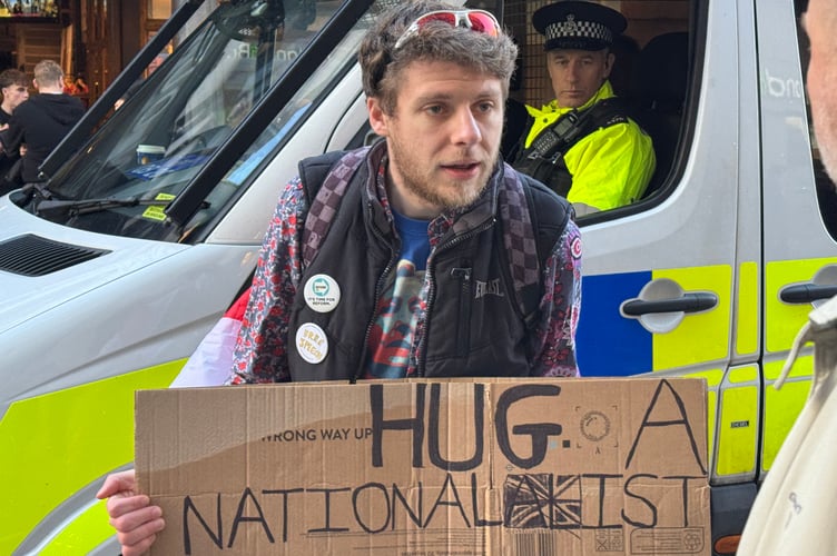 Frankie Ruffolo of Exeter with his banner in the Britain First/UKIP march.  AQ 2597
