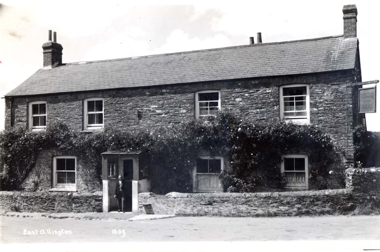 Man standing in doorway of Fortescue Arms, East Allington around 1950