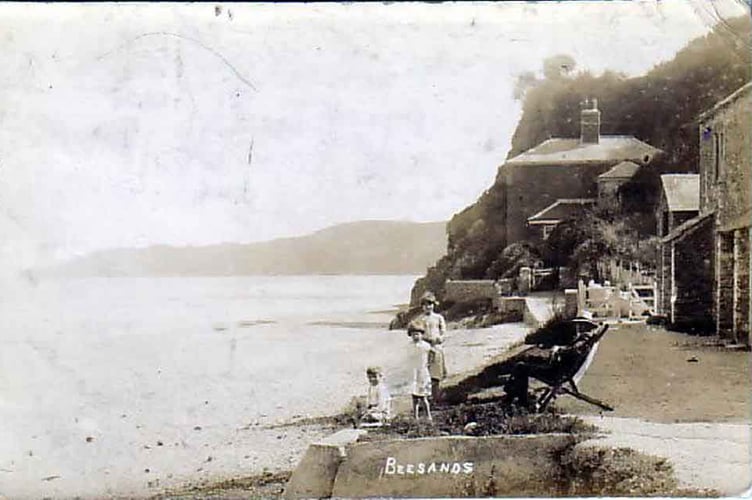 Beesands Moses', man in deckchair with three children on the sea wall