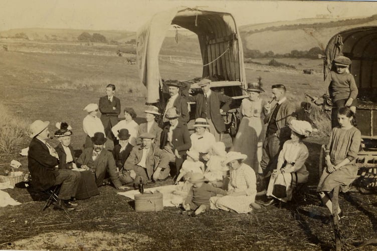 Lapthorne family picnic, sitting in front of covered wagons/horse drawn traps at Bantham Ham.