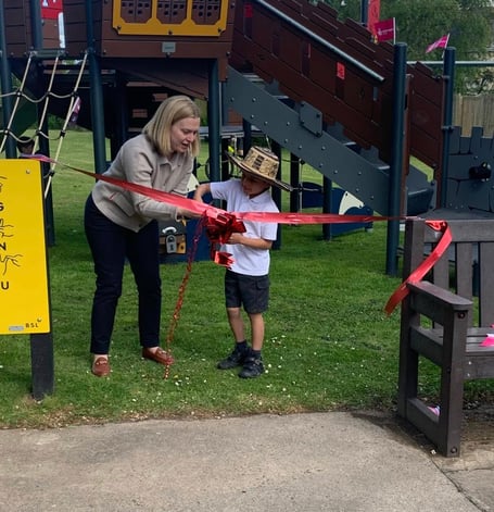 Rebecca Smith MP helped by six year old Ralph cut the ribbon