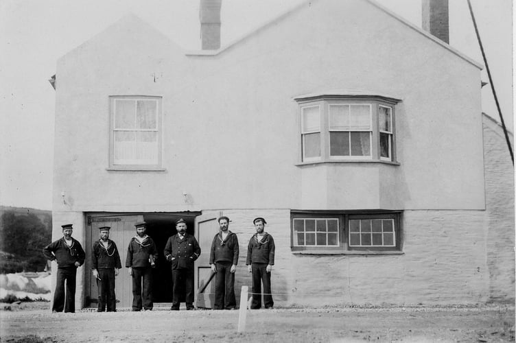 Torcross coastguards outside watch house in their uniform