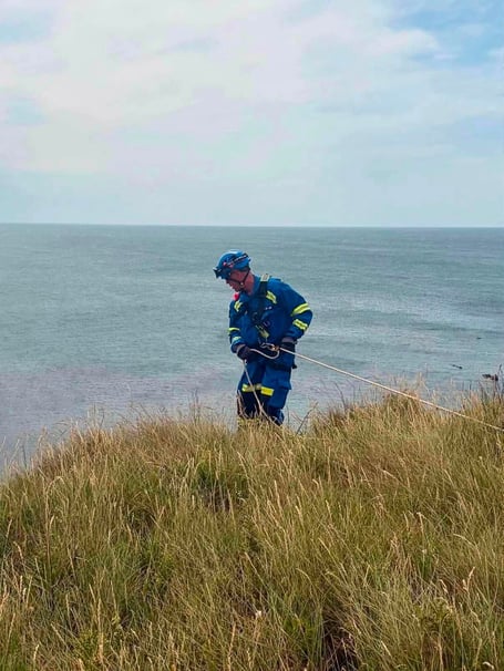 The team set up an edge safety system to search over cliff edges to try and locate the casualty. - Kingsbridge Coastguard Rescue Team