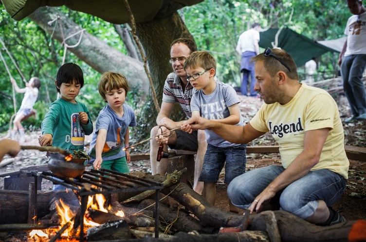 DadFest cooking around a campsire.